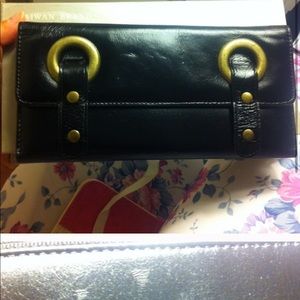 Black leather wallet with gold metal design